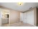 Neutral bedroom with closet and ensuite bathroom featuring a spacious vanity and ample storage at 1651 Summit Way, Dunedin, FL 34698