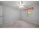 Bright bedroom with carpet and window with a decorative valence at 1651 Summit Way, Dunedin, FL 34698