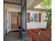 Open entryway features a screened-in doorway leading to a view of the front yard at 1651 Summit Way, Dunedin, FL 34698