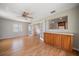 A spacious living room with lots of natural light and hardwood floors at 1651 Summit Way, Dunedin, FL 34698