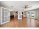 A spacious living room with lots of natural light and hardwood floors at 1651 Summit Way, Dunedin, FL 34698