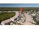 Beautiful aerial view of this community showing the tile roofs and mature trees and shrubbery throughout at 1806 Lago Vista Blvd, Palm Harbor, FL 34685