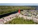 Excellent aerial view of this property with canal access and bridge to island at 1806 Lago Vista Blvd, Palm Harbor, FL 34685