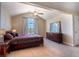 Vaulted ceiling bedroom with large window and decorative furnishings at 1806 Lago Vista Blvd, Palm Harbor, FL 34685
