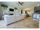 Spacious living room open to the dining area features a fireplace, a stylish bar, and lots of natural light at 1806 Lago Vista Blvd, Palm Harbor, FL 34685