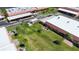 Aerial shot showing the landscaped backyard, patio, and well-maintained grounds of the condo community at 19029 Us Highway 19 N # 27A, Clearwater, FL 33764