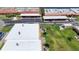 Aerial view of the property showing the parking, lawn and several buildings in the community at 19029 Us Highway 19 N # 27A, Clearwater, FL 33764
