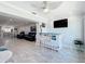 Bright bar area with white-washed wooden bar opening to the living room at 19029 Us Highway 19 N # 27A, Clearwater, FL 33764