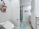 Modern bathroom featuring a sleek toilet and glass-enclosed shower, enhanced by soft lighting and marine themed decor at 19029 Us Highway 19 N # 27A, Clearwater, FL 33764