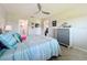 Well-lit bedroom with tiled floors featuring tropical decor, stylish furniture, and plenty of natural light at 19029 Us Highway 19 N # 27A, Clearwater, FL 33764