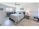 Light-filled bedroom with tiled floors featuring tropical decor, stylish furniture, and plenty of natural light at 19029 Us Highway 19 N # 27A, Clearwater, FL 33764