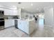 Updated kitchen with stainless steel appliances, white cabinets, eat-in counter, and open floor plan at 19029 Us Highway 19 N # 27A, Clearwater, FL 33764