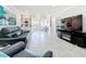 Bright living room with stylish shelves and open access to outdoor space at 19029 Us Highway 19 N # 27A, Clearwater, FL 33764