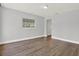 Bedroom with laminate floors, baseboards and neutral paint at 1908 E Mcberry St, Tampa, FL 33610
