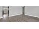 Bedroom with gray walls and stunning laminate flooring and baseboards at 1908 E Mcberry St, Tampa, FL 33610