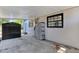 Functional carport adjacent to the house offers sheltered parking and convenient access to storage at 1908 E Mcberry St, Tampa, FL 33610