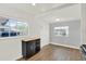 Dining area with wood floors, bright windows, and neutral walls provides an inviting eating space at 1908 E Mcberry St, Tampa, FL 33610