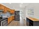 Kitchen features wood cabinets, stainless steel appliances, and lots of storage at 1908 E Mcberry St, Tampa, FL 33610