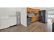 Kitchen featuring stainless steel appliances, wood cabinets, and laundry area at 1908 E Mcberry St, Tampa, FL 33610