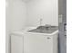 Practical laundry room with a modern washer and dryer setup, simplifying household chores at 1908 E Mcberry St, Tampa, FL 33610