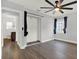 Main bedroom showing laminate floors, a walk in closet and a peak at the ensuite bathroom at 1908 E Mcberry St, Tampa, FL 33610