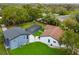 Stunning aerial view of a home with a screened pool and well-manicured green lawn at 20 2Nd Se Ave, Lutz, FL 33549