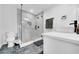 Modern bathroom features a glass-enclosed shower, stylish vanity, and updated fixtures at 20 2Nd Se Ave, Lutz, FL 33549