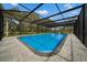 A screened-in pool offers a private and enjoyable swimming experience at 20 2Nd Se Ave, Lutz, FL 33549