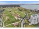 Stunning aerial view of the golf course, bay and surrounding area with high rise condos near the water at 220 Belleview Blvd # 701, Belleair, FL 33756