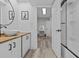 Modern bathroom featuring a vessel sink, wood counters, and shower at 220 Belleview Blvd # 701, Belleair, FL 33756