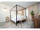 Stylish bedroom showcasing a four-poster bed and decor at 220 Belleview Blvd # 701, Belleair, FL 33756