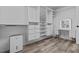 Large walk-in closet featuring custom shelving, drawers and a makeup station at 220 Belleview Blvd # 701, Belleair, FL 33756