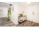 Inviting entryway with wood-look flooring, console table, and modern decor at 220 Belleview Blvd # 701, Belleair, FL 33756