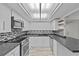 Modern kitchen featuring stainless steel appliances, stylish backsplash, and ample counter space at 220 Belleview Blvd # 701, Belleair, FL 33756