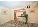 Bright kitchen with stainless steel refrigerator, breakfast bar with stools, and stylish gray backsplash at 220 Belleview Blvd # 701, Belleair, FL 33756