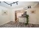 Modern kitchen with stainless steel appliances, a breakfast bar, and wood-style flooring at 220 Belleview Blvd # 701, Belleair, FL 33756