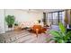 Well-lit living room featuring modern furniture, decor, and a large window with natural light and scenic views at 220 Belleview Blvd # 701, Belleair, FL 33756