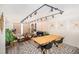 Open floor plan featuring modern track lighting, stylish furniture, plants, a dining table, and a cozy living area at 220 Belleview Blvd # 701, Belleair, FL 33756