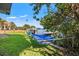Relaxing backyard featuring a hammock near the water and beautiful scenery, creating a tranquil retreat at 292 Sunlit Cove Ne Dr, St Petersburg, FL 33702