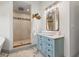 Bright bathroom featuring a soaking tub, walk-in shower, vessel sink, and marble tile floor at 292 Sunlit Cove Ne Dr, St Petersburg, FL 33702