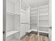 Walk-in closet featuring custom white shelving and storage at 292 Sunlit Cove Ne Dr, St Petersburg, FL 33702