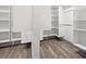 Walk-in closet showcasing custom white shelving and storage at 292 Sunlit Cove Ne Dr, St Petersburg, FL 33702