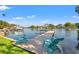 Picturesque waterfront scene featuring a private dock with chairs, offering a tranquil spot for relaxation at 292 Sunlit Cove Ne Dr, St Petersburg, FL 33702