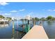 Private boat lift dock offers convenient access to the water, perfect for boating enthusiasts and waterfront living at 292 Sunlit Cove Ne Dr, St Petersburg, FL 33702