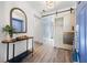 Foyer featuring an accent wall, barn door, and a decorative table at 292 Sunlit Cove Ne Dr, St Petersburg, FL 33702