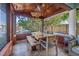 Charming patio with a wooden table and chairs offers a unique outdoor dining experience near the water at 292 Sunlit Cove Ne Dr, St Petersburg, FL 33702