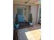 Welcoming entryway with a decorative blue front door and potted plants at 3122 Egret Ter, Safety Harbor, FL 34695