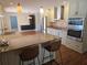 Modern kitchen featuring granite counters, stainless steel appliances, and a breakfast bar at 3122 Egret Ter, Safety Harbor, FL 34695