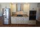 Updated kitchen features stainless steel appliances, granite countertops, and custom cabinetry at 3122 Egret Ter, Safety Harbor, FL 34695