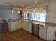 Bright kitchen boasts granite countertops, stainless steel appliances, and a view of the pool at 3122 Egret Ter, Safety Harbor, FL 34695
